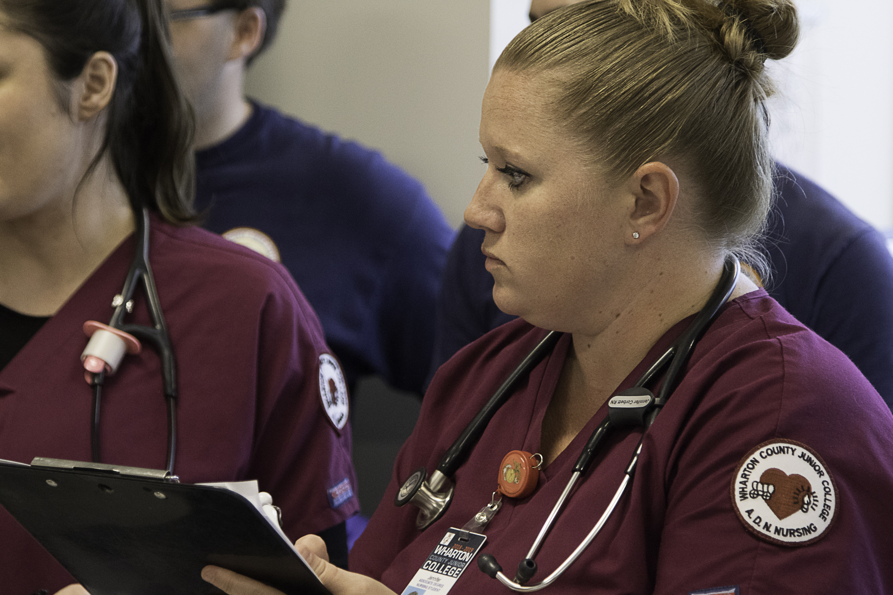 nursing students with charts